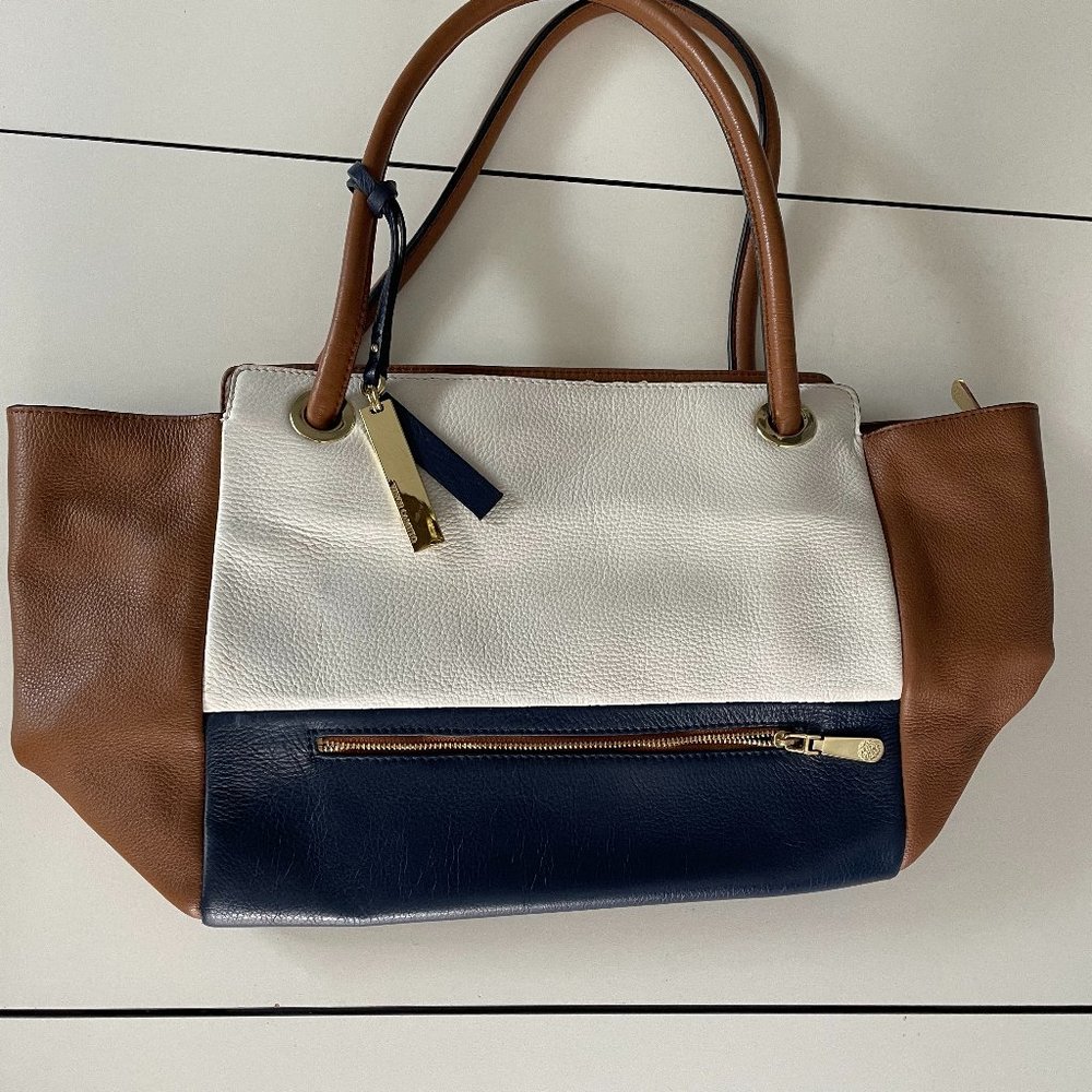 VINCE CAMUTO NAVY, WHITE, AND TAN POCKETBOOK